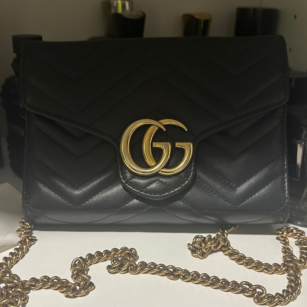 Slightly used  Gucci Black Quilted Crossbody Bag with Gold Accents